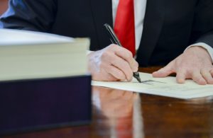 President Trump Signs The Tax Cuts And Jobs Act Into Law